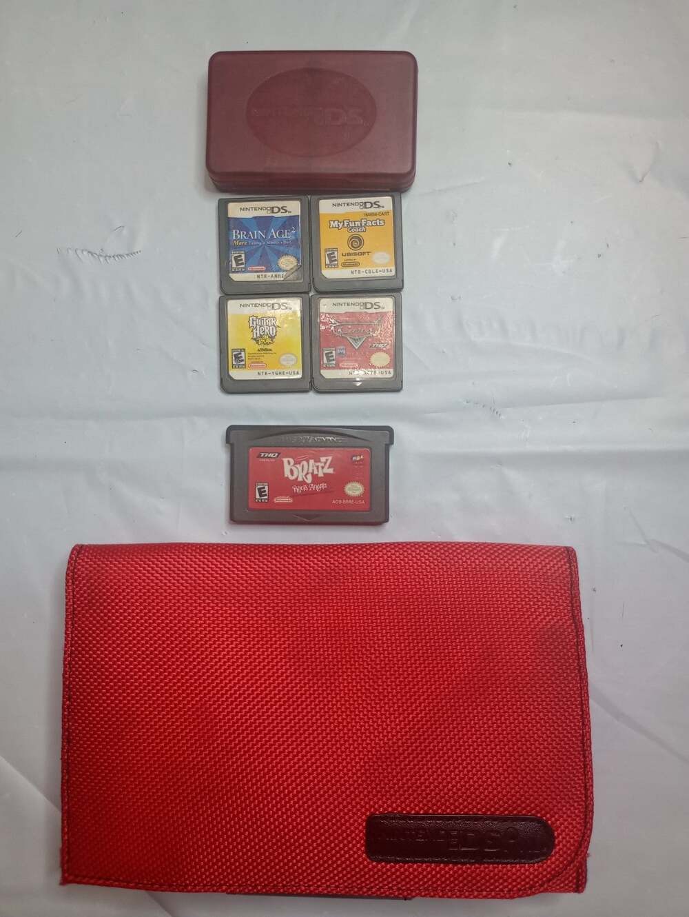 red game case 4 Nintendo DS games 1 Gameboy Another 4 Game Holder